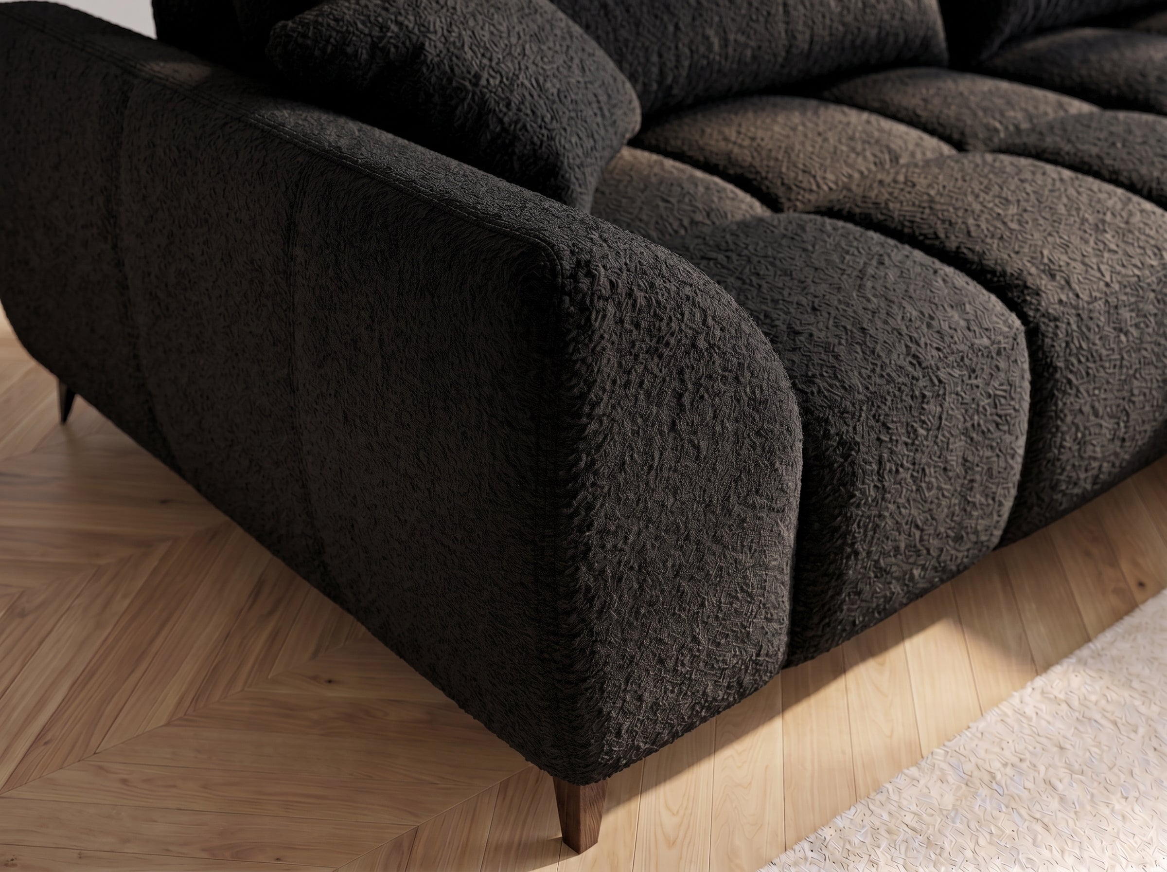 Canapé d'angle convertible BATIGNOLLES bouclé noir avec coffre de rangement - détail du tissu bouclé