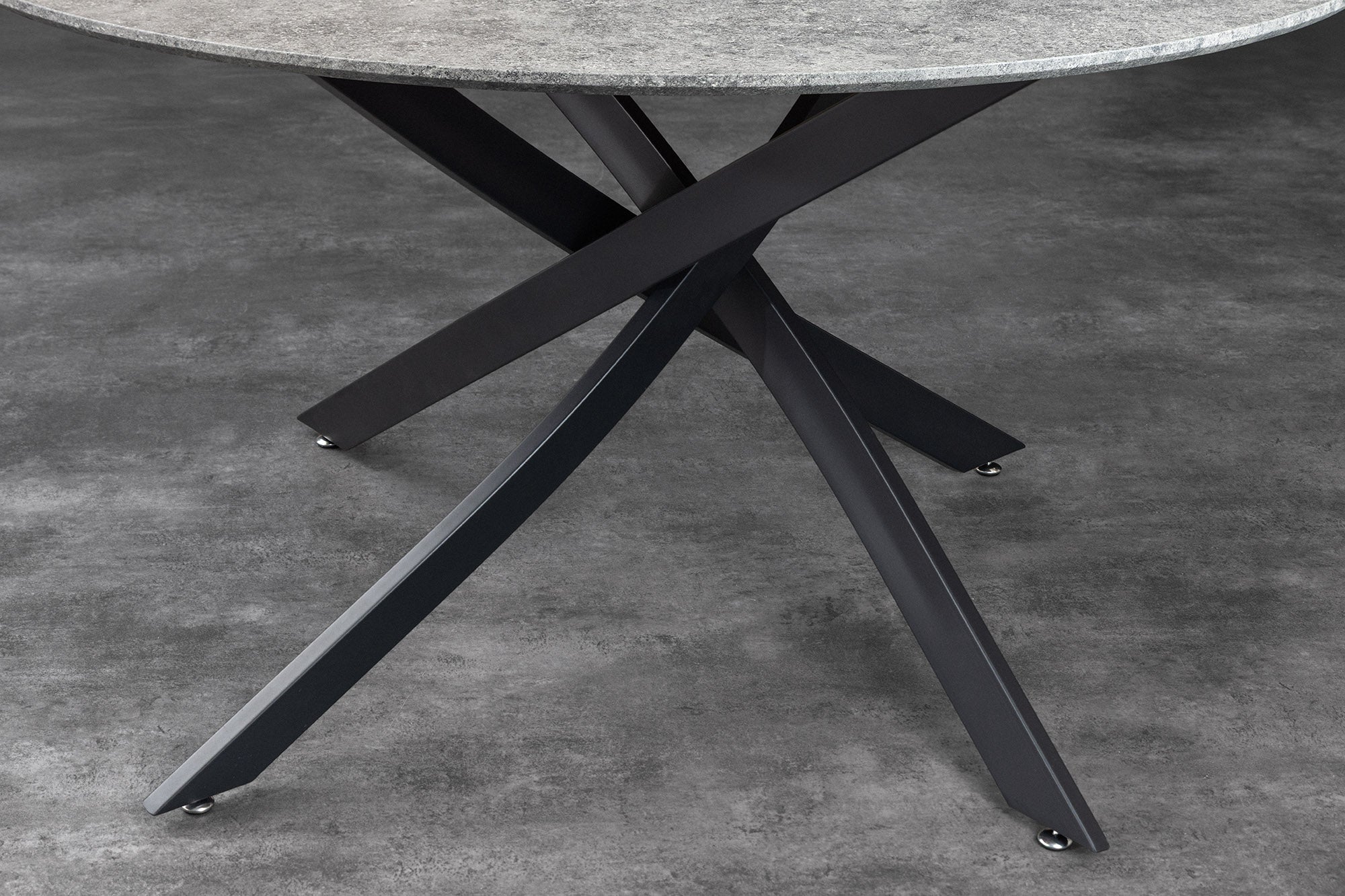 Table à manger ronde HELIX 120cm design béton gris pieds métal noir structure étoile