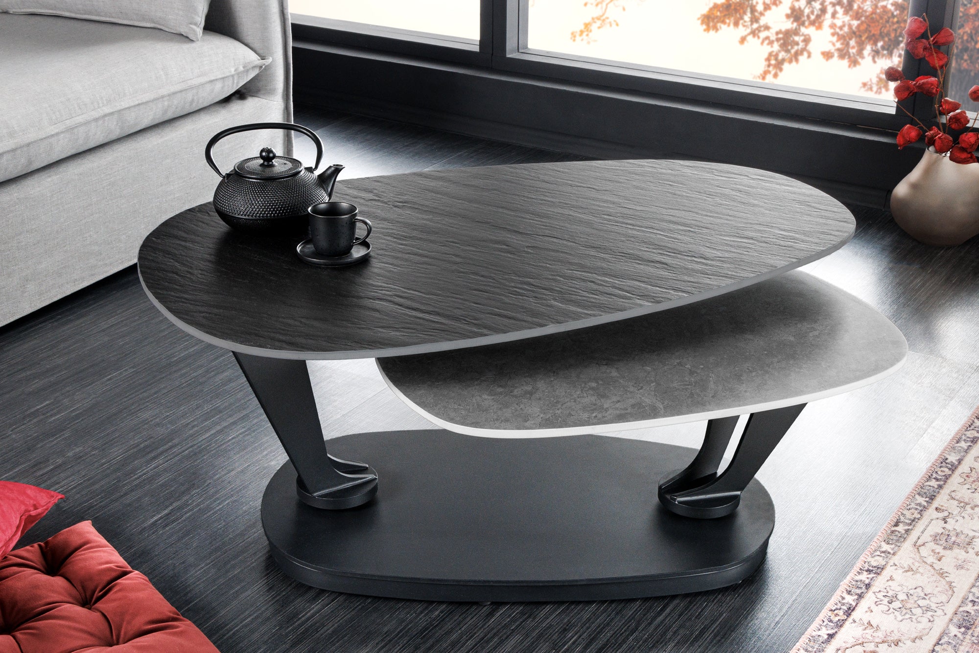 Table basse design MOVEMENT noire grise ronde rotative en céramique avec structure en métal