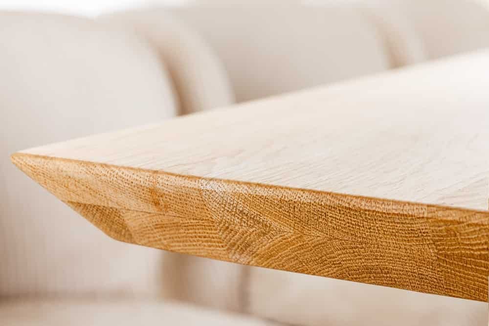 Table à manger ovale ART DECO 220cm en manguier massif beige finition crème avec piètement colonne