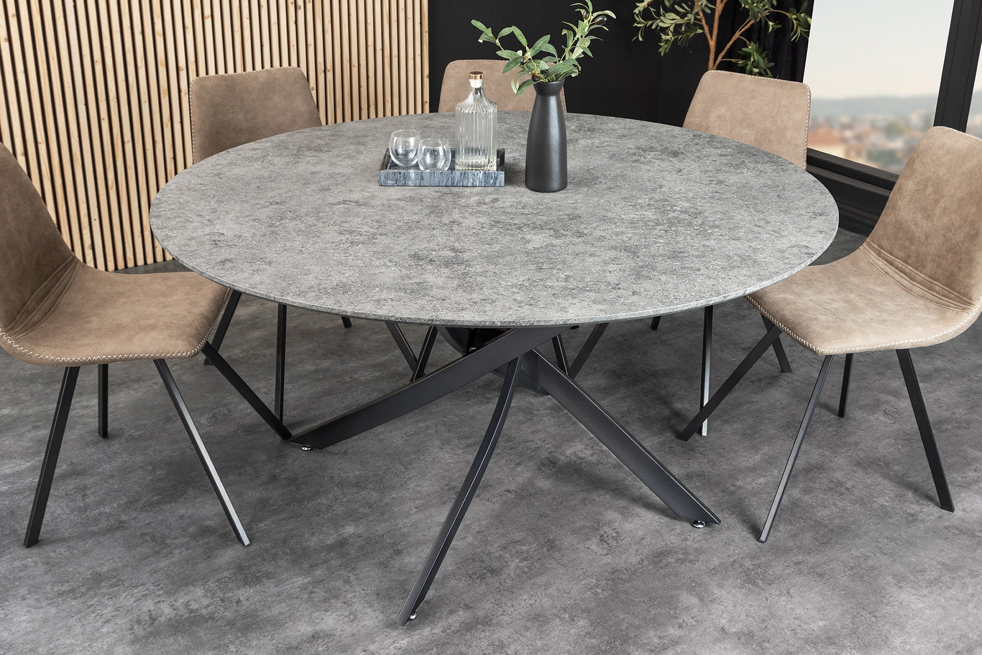 Table à manger ronde HELIX 120cm design béton gris pieds métal noir structure étoile
