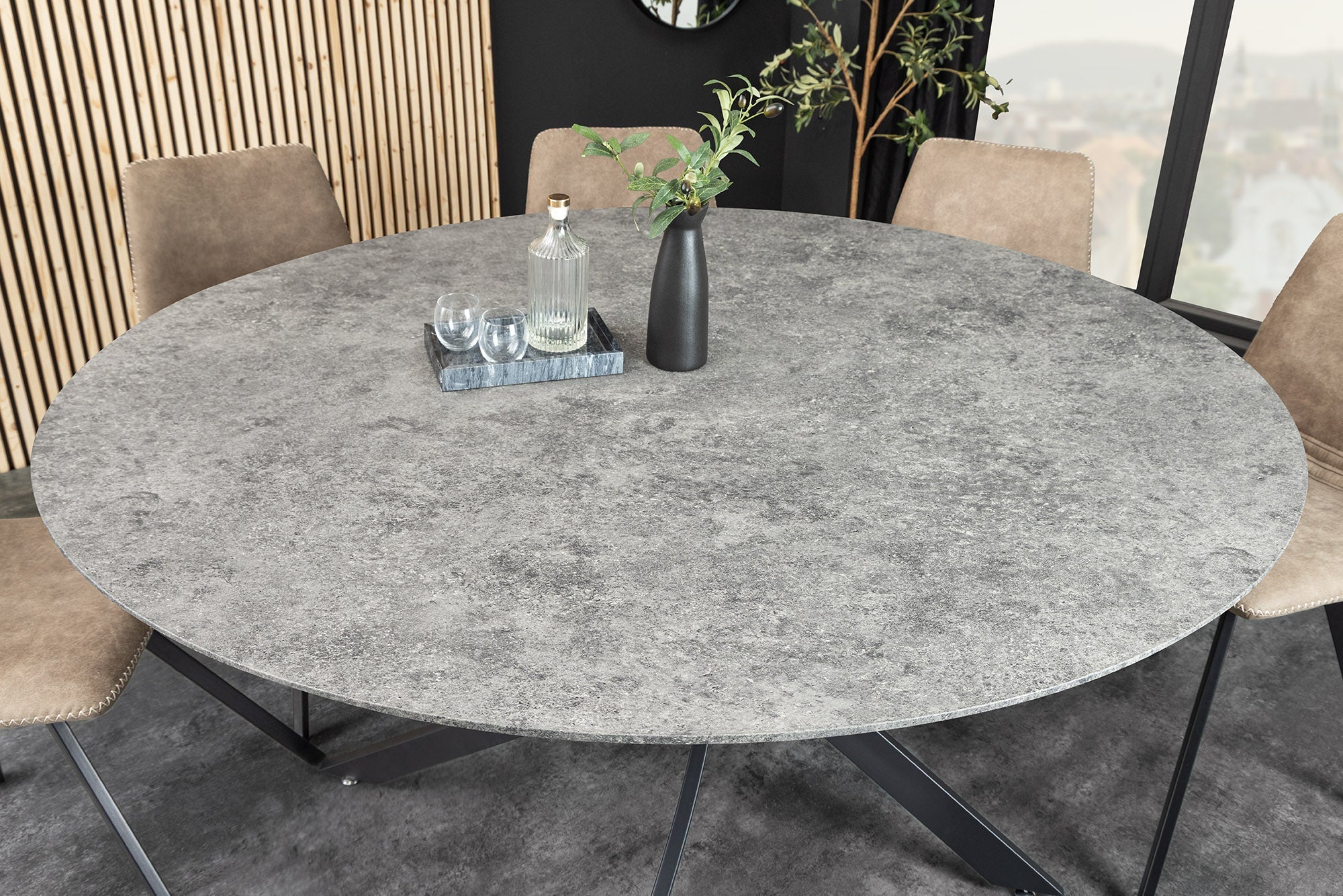 Table à manger ronde HELIX 120cm design béton gris pieds métal noir structure étoile