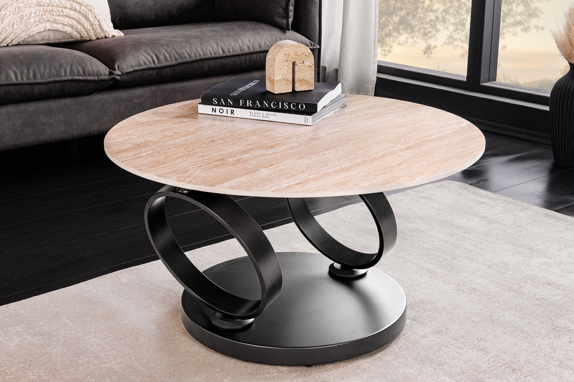 Table basse design DANCING RINGS rouille ronde tournante en céramique travertin structure noire
