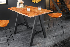 Table de bar en bois massif MAMMUT 120cm acacia naturel bord métal noir avec repose-pieds
